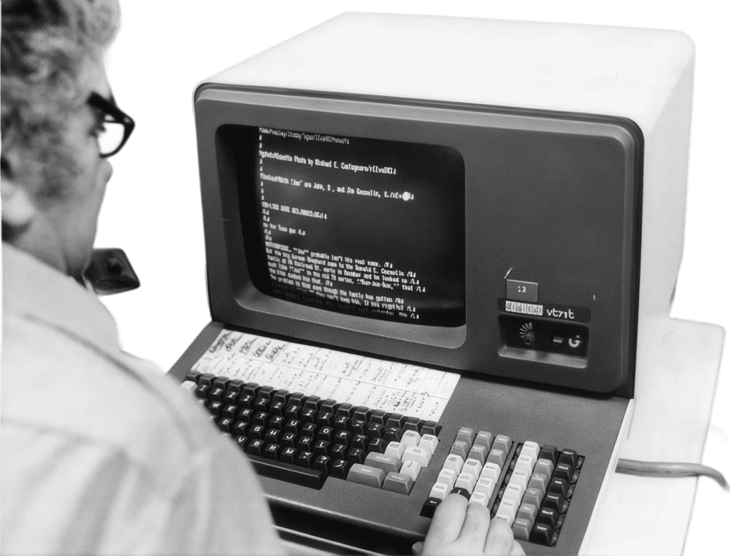 Analyst working at a vintage computer terminal